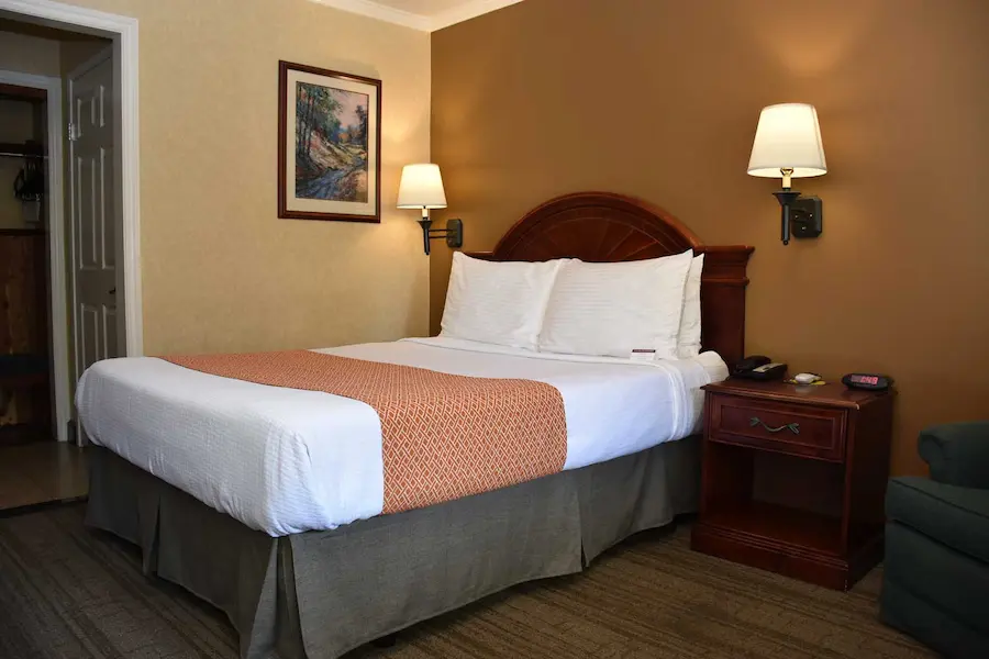 Deluxe Queen room photographed at Dynasty Suites Redlands
